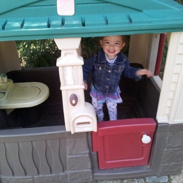 Enjoying her "new" playhouse